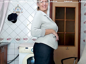 Lukerya tries on the top of a cag not far from a skirt, shows unvarnished titties